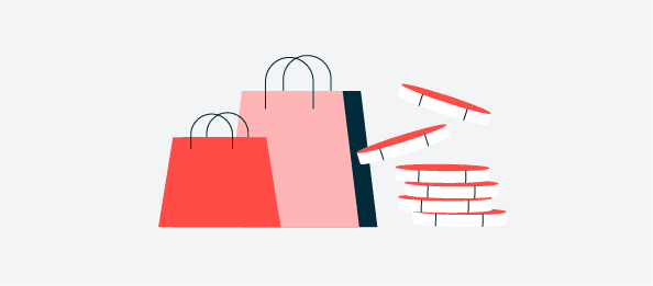 Bolsas de compras con monedas apiladas al lado